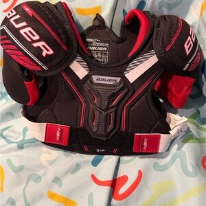 Bauer Chest Plate Black and Red for youth ages 3-5. Never worn, used in display